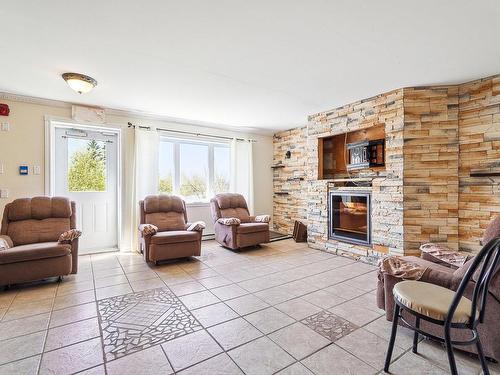 Common room - 65 Rue Ste-Anne, L'Épiphanie, QC - Indoor Photo Showing Living Room With Fireplace