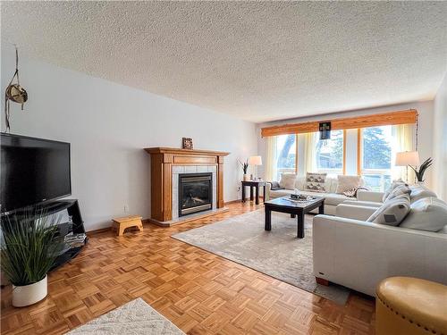 215 Aberdeen Avenue, Brandon, MB - Indoor Photo Showing Living Room With Fireplace