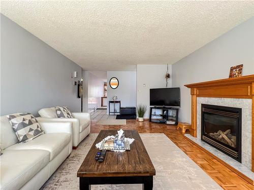 215 Aberdeen Avenue, Brandon, MB - Indoor Photo Showing Living Room With Fireplace