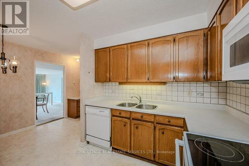 306 - 2175 Marine Drive, Oakville, ON - Indoor Photo Showing Kitchen With Double Sink