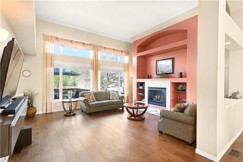 448 De La Seigneurie Boulevard, Winnipeg, MB - Indoor Photo Showing Living Room With Fireplace
