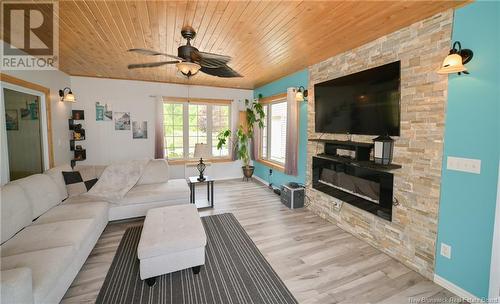 4 Sunview Lane, Wuhrs Beach, NB - Indoor Photo Showing Living Room With Fireplace