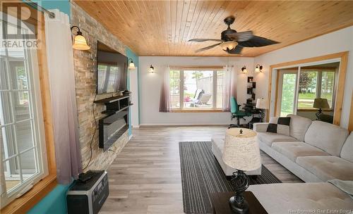 4 Sunview Lane, Wuhrs Beach, NB - Indoor Photo Showing Living Room With Fireplace