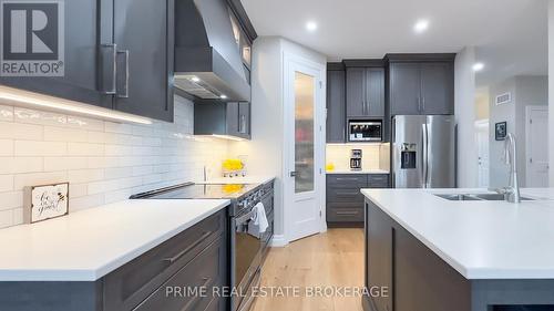 303 Hazelton Lane, South Huron (Exeter), ON - Indoor Photo Showing Kitchen With Double Sink With Upgraded Kitchen