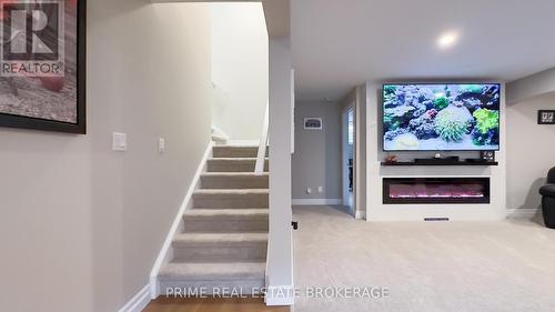 303 Hazelton Lane, South Huron (Exeter), ON - Indoor Photo Showing Other Room With Fireplace