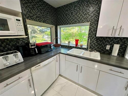 57 Sunset Drive, Ditch Lake, MB - Indoor Photo Showing Kitchen With Double Sink