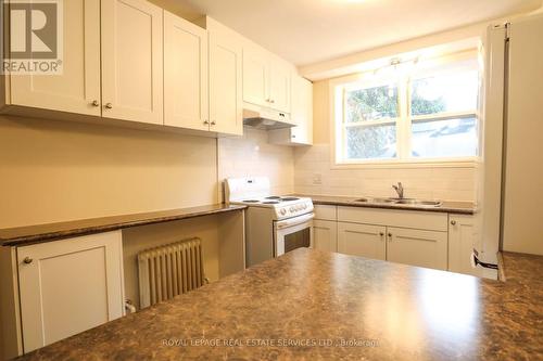 #1 - 61 Third Street, Toronto, ON - Indoor Photo Showing Kitchen With Double Sink