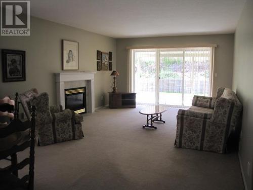 20 500 Wotzke Drive, Williams Lake, BC - Indoor Photo Showing Living Room With Fireplace