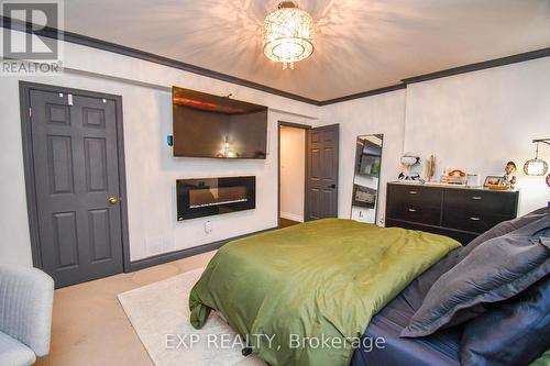 17 Highland Drive, Oro-Medonte (Horseshoe Valley), ON - Indoor Photo Showing Bedroom With Fireplace