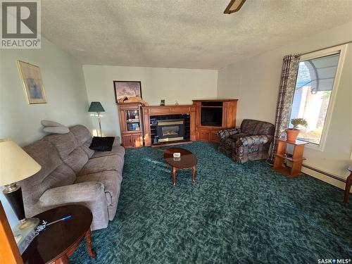 100 Lundy Place, Stoughton, SK - Indoor Photo Showing Living Room With Fireplace