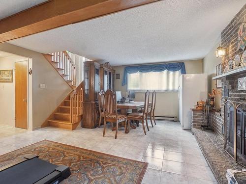 Salle familiale - 1074 Rue De Belgrade O., Laval (Auteuil), QC - Indoor Photo Showing Dining Room With Fireplace