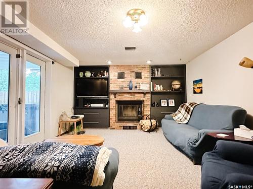 350 Battleford Trail, Swift Current, SK - Indoor Photo Showing Living Room With Fireplace