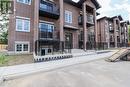 233 Watson Unit# 106, Windsor, ON  - Outdoor With Balcony With Facade 