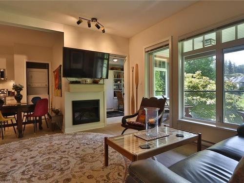 216-1375 Bear Mountain Pkwy, Langford, BC - Indoor Photo Showing Living Room With Fireplace