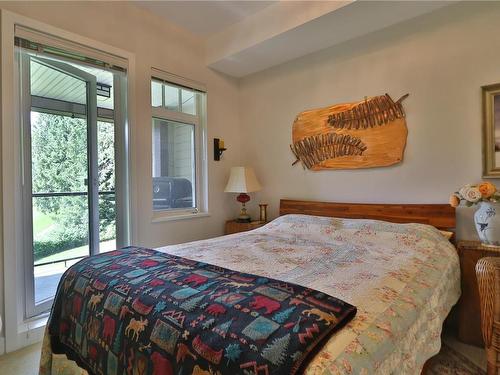 216-1375 Bear Mountain Pkwy, Langford, BC - Indoor Photo Showing Bedroom
