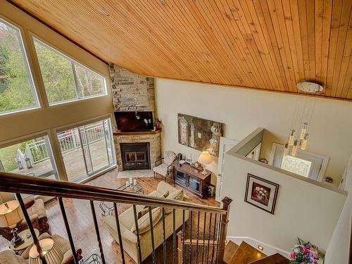 Overall view - 138 Mtée Des Cèdres, Saint-Adolphe-D'Howard, QC - Indoor Photo Showing Other Room With Fireplace