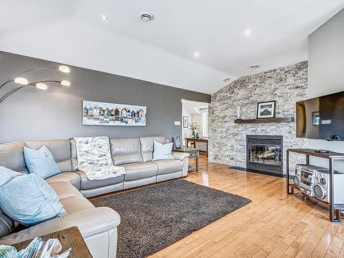 Living room - 30-764 Rue Jean-Deslauriers, Boucherville, QC - Indoor Photo Showing Living Room With Fireplace