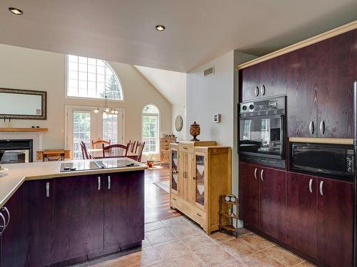 Cuisine - 135  - 137 Rue Du Rapide, Mont-Tremblant, QC - Indoor Photo Showing Kitchen With Fireplace