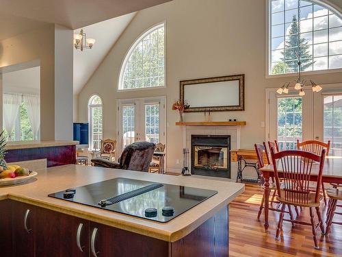 Kitchen - 135  - 137 Rue Du Rapide, Mont-Tremblant, QC - Indoor With Fireplace