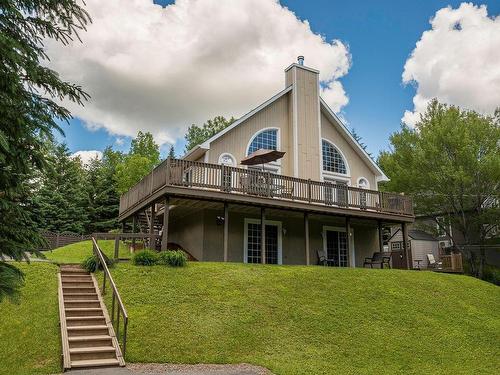 Frontage - 135  - 137 Rue Du Rapide, Mont-Tremblant, QC - Outdoor With Deck Patio Veranda