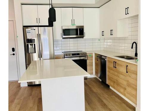 504-2461 Gateway Rd, Langford, BC - Indoor Photo Showing Kitchen With Stainless Steel Kitchen With Double Sink With Upgraded Kitchen