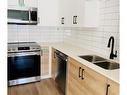 504-2461 Gateway Rd, Langford, BC  - Indoor Photo Showing Kitchen With Stainless Steel Kitchen With Double Sink 