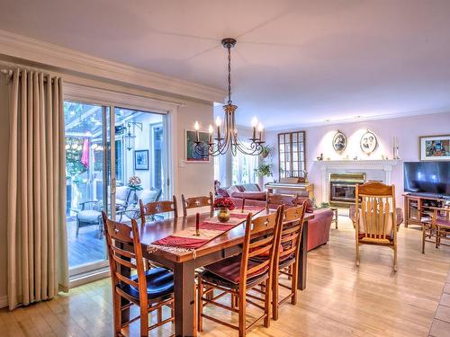 Dining room - 775 Rue Du Patrimoine, Prévost, QC - Indoor Photo Showing Dining Room With Fireplace