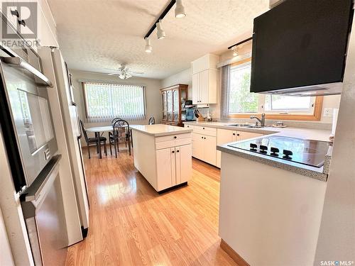 211 Ash Drive, Weyburn, SK - Indoor Photo Showing Kitchen With Double Sink