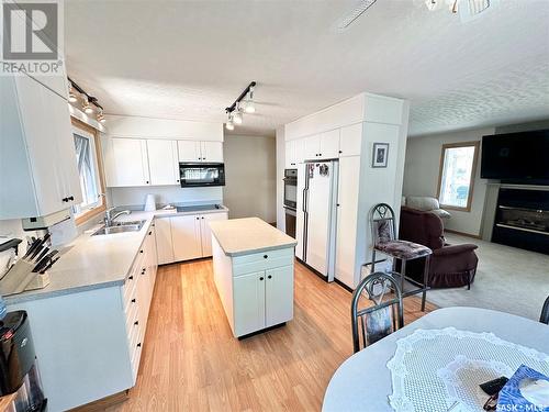 211 Ash Drive, Weyburn, SK - Indoor Photo Showing Kitchen With Double Sink