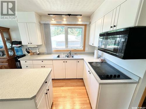 211 Ash Drive, Weyburn, SK - Indoor Photo Showing Kitchen With Double Sink