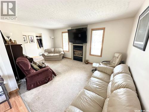 211 Ash Drive, Weyburn, SK - Indoor Photo Showing Living Room With Fireplace