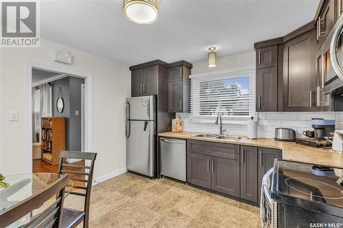 311 109Th Street W, Saskatoon, SK - Indoor Photo Showing Kitchen With Double Sink