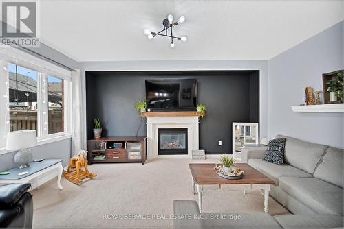 22 Thomas Woodlock Street, Clarington, ON - Indoor Photo Showing Living Room With Fireplace