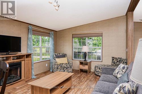 486 Cty Rd 18- 18 Dragonfly Lane, Prince Edward County (Athol), ON - Indoor Photo Showing Living Room With Fireplace