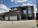 6005 Eagles Cove, Regina, SK  - Outdoor With Facade 