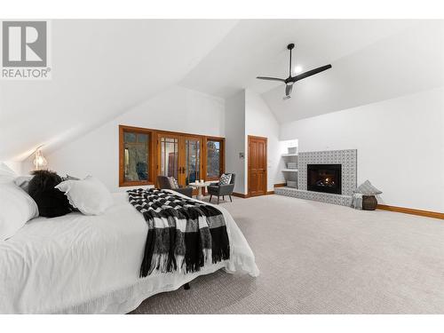 539 Knowles Road, Kelowna, BC - Indoor Photo Showing Bedroom With Fireplace