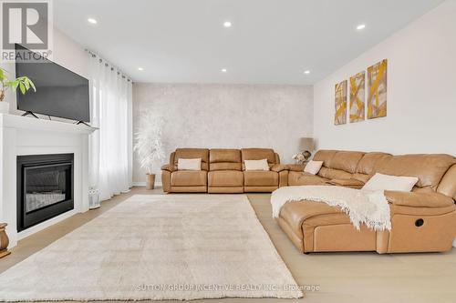 16 Samuel Crescent, Springwater (Centre Vespra), ON - Indoor Photo Showing Living Room With Fireplace