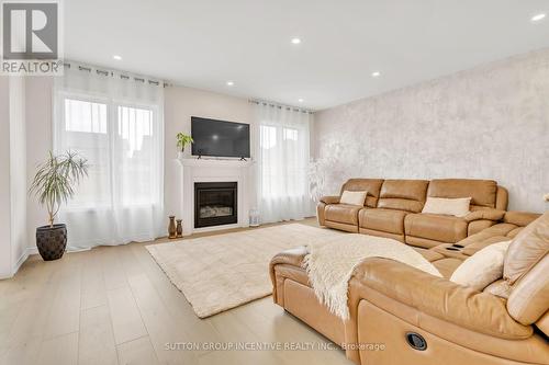 16 Samuel Crescent, Springwater (Centre Vespra), ON - Indoor Photo Showing Living Room With Fireplace