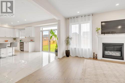 16 Samuel Crescent, Springwater (Centre Vespra), ON - Indoor Photo Showing Living Room With Fireplace