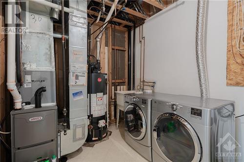 laundry and utilities on the lower level - 132 Castle Glen Crescent, Kanata, ON - Indoor Photo Showing Laundry Room