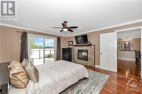 145 Appel Lane, Greater Madawaska, ON - Indoor Photo Showing Bedroom With Fireplace