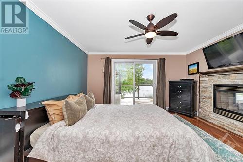 145 Appel Lane, Greater Madawaska, ON - Indoor Photo Showing Bedroom With Fireplace