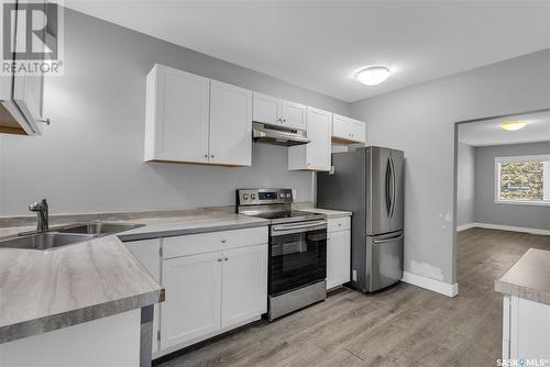 718 7Th Street E, Saskatoon, SK - Indoor Photo Showing Kitchen With Double Sink