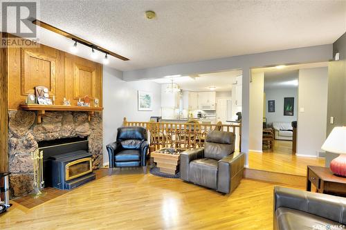 318 Wakabayashi Crescent, Saskatoon, SK - Indoor Photo Showing Living Room With Fireplace