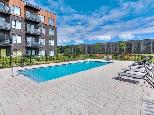 Pool - 109-3025 Av. Des Gouverneurs, Laval (Duvernay), QC - Outdoor With In Ground Pool