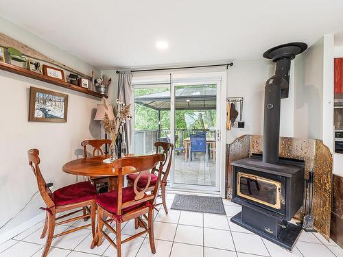 Dining room - 36 Rue Des Érables, Hatley - Municipalité, QC - Indoor Photo Showing Dining Room With Fireplace