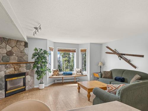 211-225 Kettle View Road, Big White, BC - Indoor Photo Showing Living Room With Fireplace