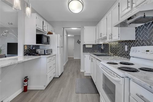 101-1610 Gordon Drive, Kelowna, BC - Indoor Photo Showing Kitchen With Double Sink