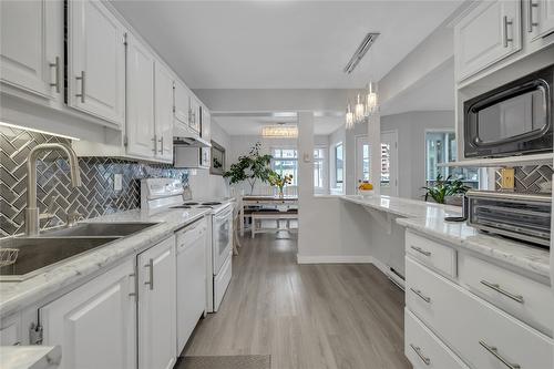 101-1610 Gordon Drive, Kelowna, BC - Indoor Photo Showing Kitchen With Double Sink