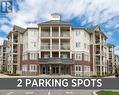 211 - 84 Aspen Springs Drive, Clarington, ON  - Outdoor With Balcony With Facade 